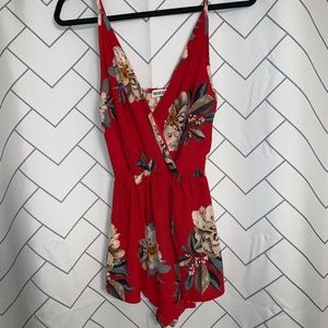 Reverse floral romper size 8